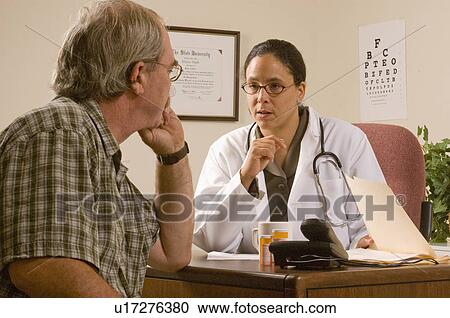 Stock Image -  hand doctor female african american male patient. Fotosearch