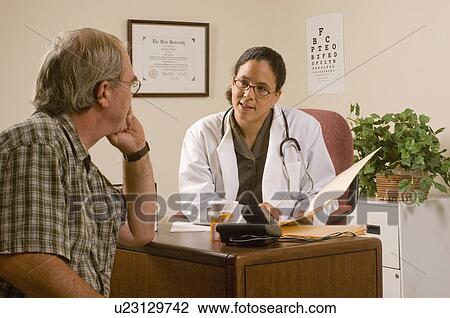 Stock Image -  hand doctor female african american male patient. Fotosearch