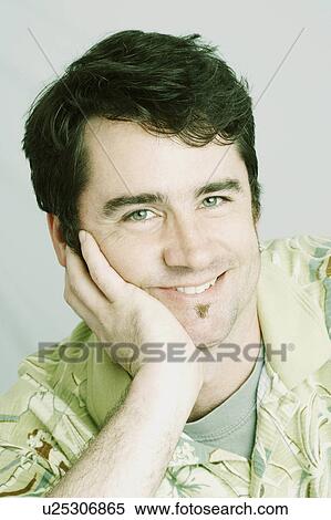 Stock Photography -  hand man portrait mature smiling chin 40-44 years. Fotosearch