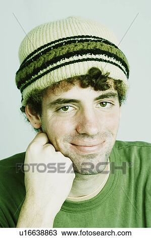 Stock Image -  hand man portrait young grinning chin 20-24 years. Fotosearch