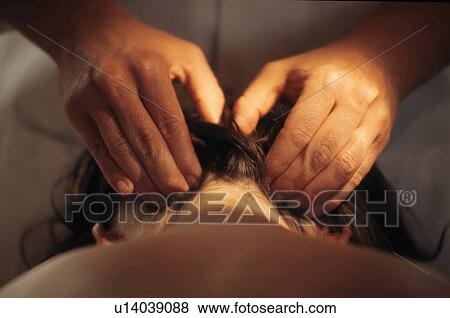 Stock Photo -  hand person massage cranial sacral therapy . Fotosearch