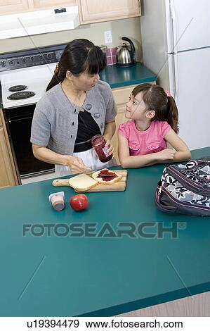 Stock Photo -  hand school first day ready for asian mother aid. Fotosearch