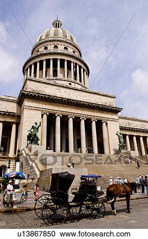 Stock Image -  horse drawn carriage taxi in front capitol cuba. Fotosearch