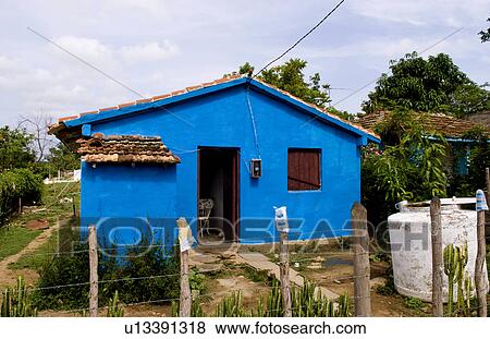 Stock Photo -  house home local painted blue in small village. Fotosearch