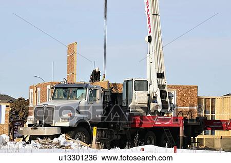 Stock Photograph -  house person construction home horozontal image. Fotosearch