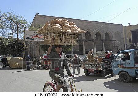 Stock Image -  man egypt khan alkhalili islamic old cairo bread . Fotosearch