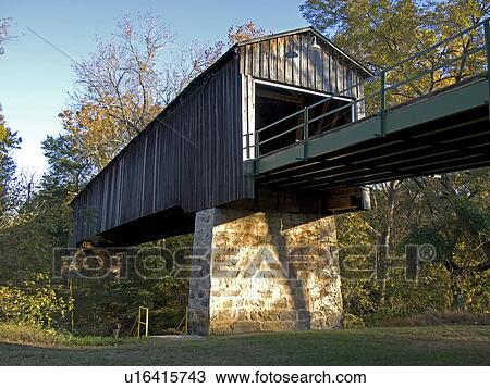 Stock Image -  man euharlee covered bridge known creek or lowry. Fotosearch