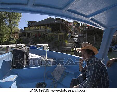 Stock Photography -  man guatemala waiting for boat depart san pedro . Fotosearch