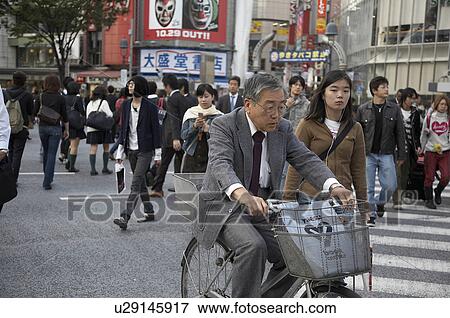 man japan shibuya tokyo bicycle asia se View Large Photo Image Stock Photo - man japan shibuya tokyo bicycle asia se . Fotosearch
