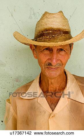 Stock Image -  man portrait local green wall in cienfurgos cuba. Fotosearch
