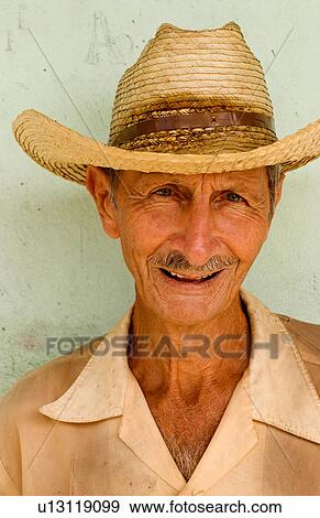 Stock Photo -  man portrait local green wall in cienfurgos cuba. Fotosearch