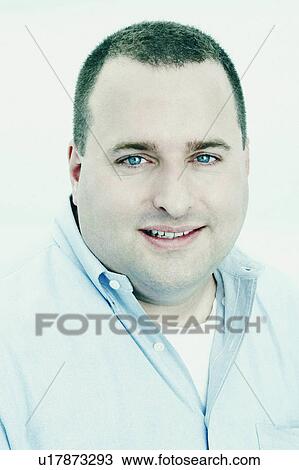 Stock Image -  man portrait mid adult smiling 35-39 years blue. Fotosearch