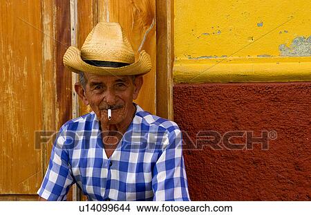 man portrait old cowboy hat in front yellow wall View Large Photo Image Picture - man portrait old cowboy hat in front yellow wall. Fotosearch