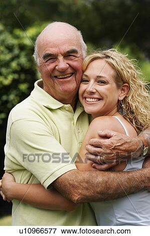 Stock Photo - man portrait senior smiling 80-84 years, granddaughter 25-29 years. Fotosearch