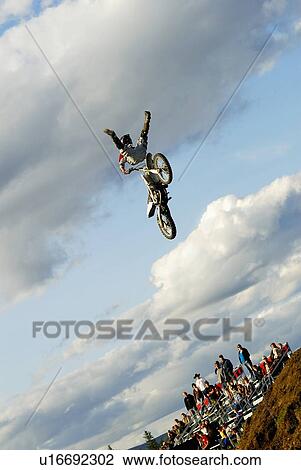 morocross rider excuting stunt outdoor event View Large Photo Image Stock Image - morocross rider excuting stunt outdoor event . Fotosearch