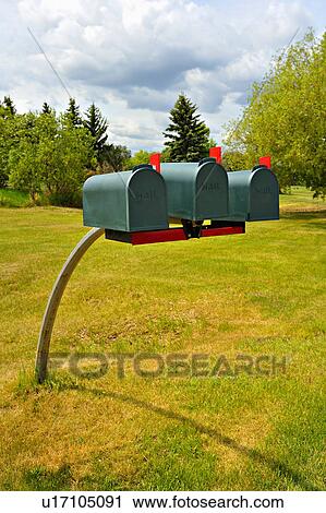 Stock Image -  office three rural mail boxes same kind size red. Fotosearch