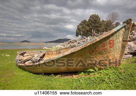 old beached fiberglass rowboat next lake in boat View Large Photo Image Stock Photography - old beached fiberglass rowboat next lake in boat. Fotosearch