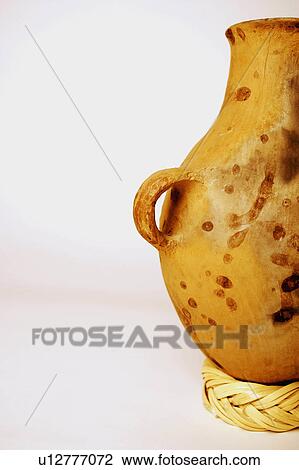 Stock Image -  people art closeup decorative pitcher craft urn. Fotosearch