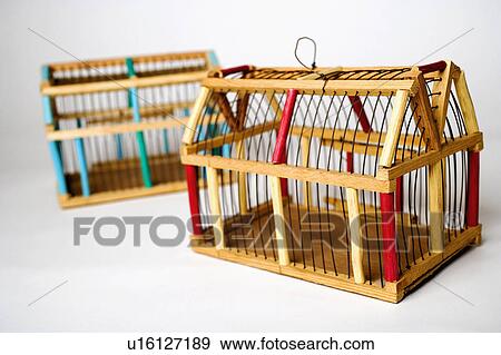 Stock Photo -  people art closeup two empty birdcages animal. Fotosearch