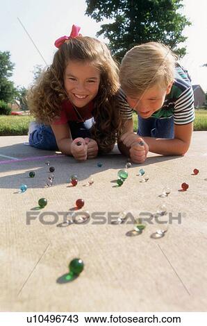 people children kids playing marbles 10-12 years View Large Photo Image Stock Image - people children kids playing marbles 10-12 years. Fotosearch