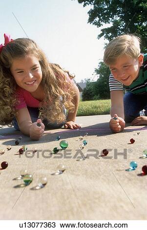 people children kids playing marbles 10-12 years View Large Photo Image Stock Image - people children kids playing marbles 10-12 years. Fotosearch
