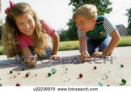 people children kids playing marbles 10-12 years View Large Photo Image Stock Photo - people children kids playing marbles 10-12 years. Fotosearch