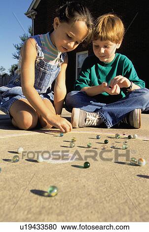 people girl children kids playing marbles 2 boy View Large Photo Image Stock Image - people girl children kids playing marbles 2 boy. Fotosearch