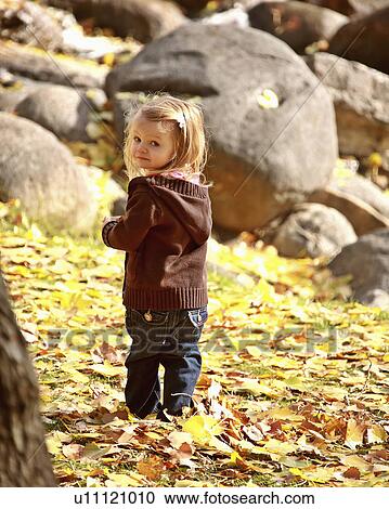 people girl children young in park autumn rocks View Large Photo Image Stock Image - people girl children young in park autumn rocks. Fotosearch