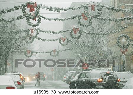 Stock Photo -  shopping snowstorm falling snow brings holiday. Fotosearch