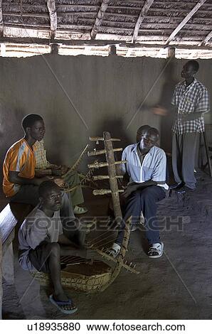 Stock Image -  south sudan catholic mass in simple mud thatch . Fotosearch