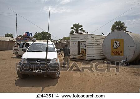Picture -  south sudan filling cars petrol station in juba. Fotosearch