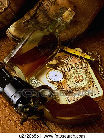 still life old west cowboy boots colt 44 caliber View Large Photo Image Stock Image - still life old west cowboy boots colt 44 caliber. Fotosearch