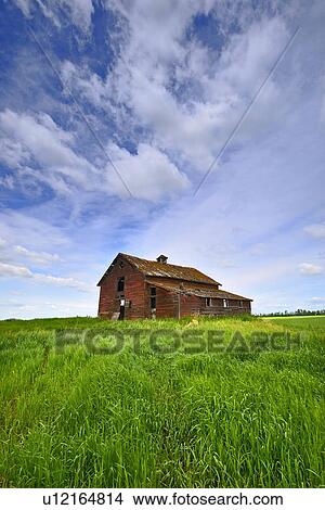 summer old abandoned red barn sits top hill View Large Photo Image Picture - summer old abandoned red barn sits top hill . Fotosearch