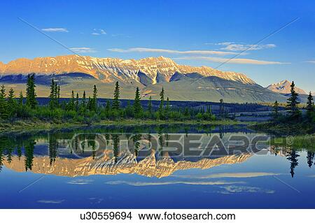 Picture -  summer this landscape image made early one river. Fotosearch