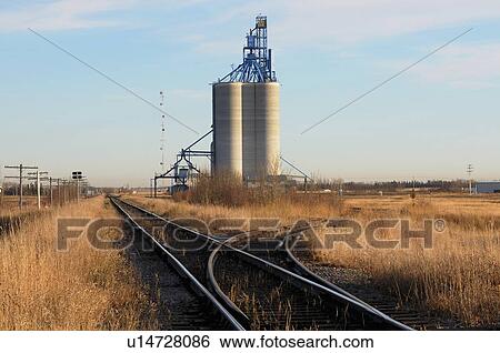 tall concrete grain storage elevator sitting View Large Photo Image Stock Photograph - tall concrete grain storage elevator sitting. Fotosearch