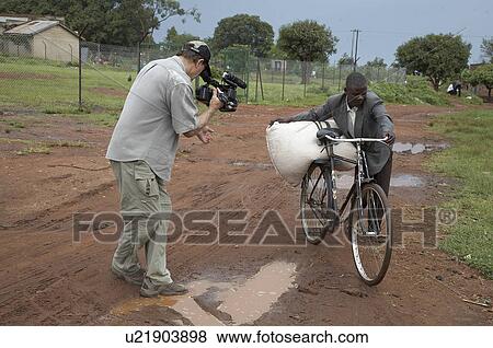uganda bringing maize community mill village View Large Photo Image Stock Photo - uganda bringing maize community mill village . Fotosearch