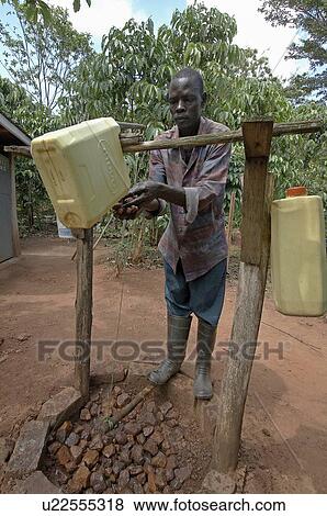 uganda tiptap simple device for washing hands View Large Photo Image Stock Photo - uganda tiptap simple device for washing hands . Fotosearch