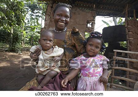 Stock Image -  uganda young farmer nsubuga emmanuel 24 wife . Fotosearch