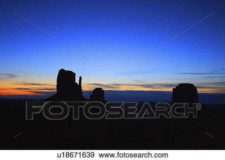 Stock Photo -  usa mounument valley three butes sunrise utah. Fotosearch