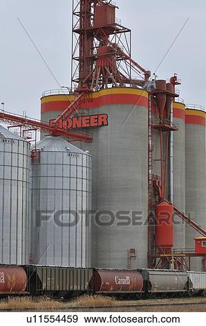 Stock Photo -  vertical image steel grain storage tanks silos. Fotosearch