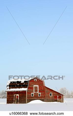 Vintage Winter Vertical Scenic Old Red Barn Stock Photo