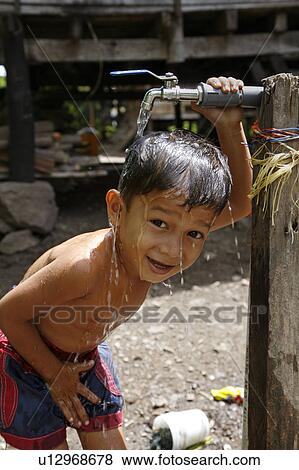 water child children indonesia boy taking bath View Large Photo Image Stock Photo - water child children indonesia boy taking bath . Fotosearch