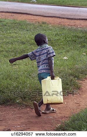 Stock Photo -  water child children uganda boy carrying jerry . Fotosearch