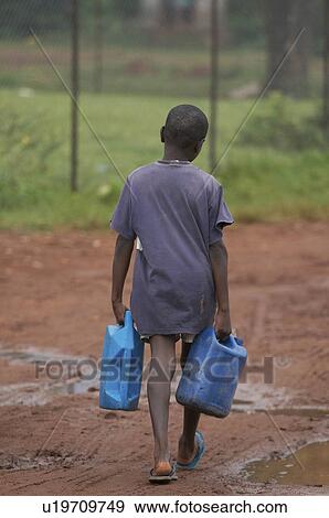 Stock Photo -  water child children uganda boy carrying village . Fotosearch