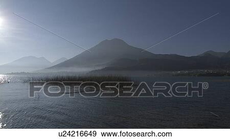 water guatemala lake atitlan in early morning la View Large Photo Image Stock Photo - water guatemala lake atitlan in early morning la . Fotosearch
