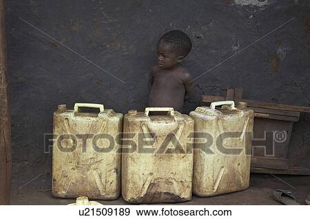 Stock Photo -  water hand child children uganda boy behind used jerrycans . Fotosearch