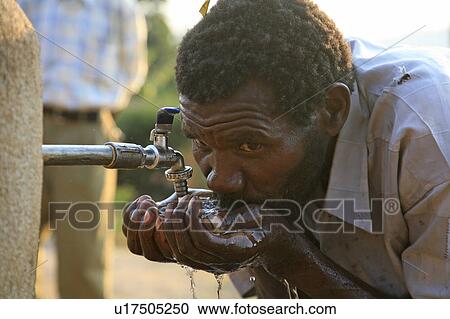 water man burundi drinking standpipe gitera sub  View Large Photo Image Stock Image -  water man burundi drinking standpipe gitera sub . Fotosearch