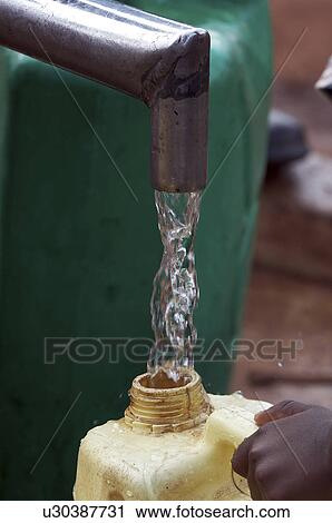 water uganda pouring pump jerry can village View Large Photo Image Stock Image - water uganda pouring pump jerry can village . Fotosearch