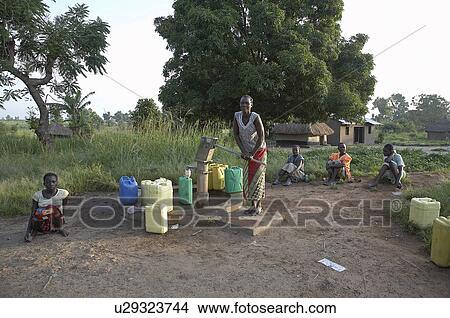Picture -  water women south sudan pumping yei 2008 africa . Fotosearch