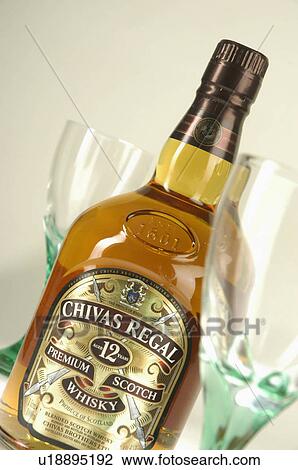 Stock Image -  wine chivas regal scotch whisky glasses 12 table. Fotosearch